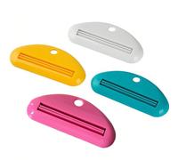 1/2/4 pièces Distributeur de crème pour les mains simple à main, outil de rouleau nettoyant pour le visage, presse-dentifrice, support de pince à dentifrice créatif pour salle de bain, maquillage, bon
