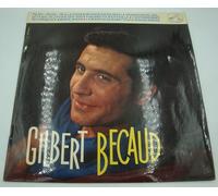 1 Disque Vinyle 33 Tours de 25 cm - GILBERT BECAUD - La Voix De Son Maitre 1093 : Pilou Pilou..he, La chanson pour Roseline, La princesse de juillet, Ah si J'avais des sous, Quand tu n'es pas là, L'enterrement de Cornélius, Marie.. Marie, La marche de Babette, Le rideau rouge - (1 disque vinyle 33t 25cm)