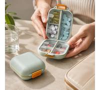 1 pilulier de 7 jours, étui de rangement portable, vert | Sept sections avec couvercle transparent, disposition double face, fermeture orange et boucle supérieure pour un transport