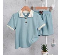 2 pièces/Set Top à col polo texturé ample et décontracté pour jeune garçon, assorti avec un pantalon ample à jambes larges. Le col polo avec garniture contrastée donne une sensation de port en plusieu