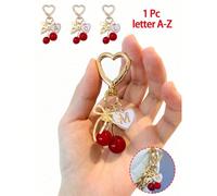 Accessoire de sac à main de haute qualité et avec nœud doré en forme de cerise - Porte-clés cerise, pendentif de sac à dos élégant, pendentif en alliage de lettre A-Z, pendentif d'écouteur, pendentif 