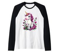 Adorable licorne rose assise parmi des chardons écossais Manche Raglan