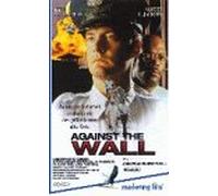 Against the wall
