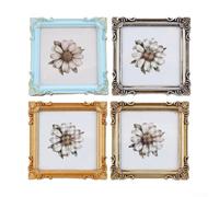 Cadre photo rustique en résine avec détails floraux en relief conçus pour encadrer de petites impressions ou souvenirs (argent antique)