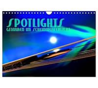 Calendrier 2027 · US Version · COUP DE PROJECTEUR - Les guitares à | l'honneur · Reflets surréalistes des lumières de la scène · DIN A4 paysage · CALVENDO Calendrier mural