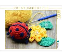 CALVENDO Puzzle Crocheted ladybug on a crocheted flower. Crochet hooks and yarn