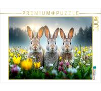 CALVENDO Puzzle Three rabbits enjoy the first warm rays of sunshine on a colorfu
