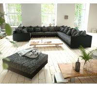 Canapé-panoramique Clovis XXL modulable noir avec tabouret et accoudoirs poufs droite