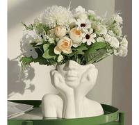 Ce design présente une forme de vase exquise, présentant la pose d'une femme avec les mains en coupe sur son visage. Le design est minimaliste mais à la mode, avec la forme unique des mains en coupe s