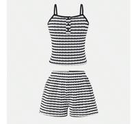 Cet ensemble de deux pièces débardeur et short décontracté pour filles est entièrement fabriqué en tissu tricoté jacquard extensible, ce qui le rend doux et confortable. Le Top présente un col ouvert