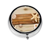 Cette petite boîte à pilules ronde sur le thème de l'océan est un organisateur de médicaments de voyage portable avec trois compartiments pour ranger des médicaments quotidiens.