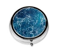 Cette petite boîte à pilules ronde sur le thème de l'océan tropical est un organisateur de médicaments de voyage portable avec trois compartiments pour ranger des médicaments quotidiens.