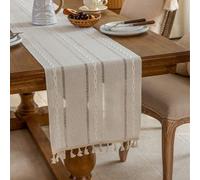 Chemin de table minimaliste chic français de couleur unie, blanc rayé avec un motif géométrique de diamants brodés et des pompons ajourés. Idéal pour la cuisine, la table de café, le meuble TV, les fê