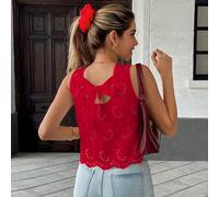 Chemise décontractée française à dos noué, sans manches, avec ourlet en tissu brodé. Sans manches pour un look nonchalant, le nœud ajoute de l'ingéniosité, la broderie est artistique. Ourlet net, coup