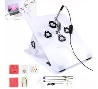 Coffret de formation à la chirurgie laparoscopique avec simulateur, comprenant 4 instruments chirurgicaux et 6 modules de formation for les étudiants en formation chirurgicale.