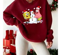 Collection Noël Bob l'éponge : Bob l'éponge et Patrick, coiffés de bonnets de Père Noël, interagissent joyeusement avec un bonhomme de neige coiffé du même bonnet, entouré de flocons de neige et rayon