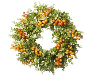 Couronne artificielle avec branches d'eucalyptus et baies pour salon d'automne et entrée