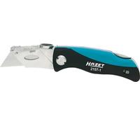 Couteau pliant HAZET 2157-1 avec lames de rechange - cutter avec manche confort et coussin pour le pouce - lame tranchante pour couper le plastique, le carton,