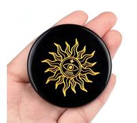 Cristaux ronds d'obsidienne noire avec pierres sculptées en forme de soleil, étoile et lune