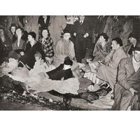 Crowds in Piccadilly London England at 3 a.m. the morning waiting for the Coronation procession of George VI and Queen Elizabeth London England 1937. From The Coronation in Pictures published 1937