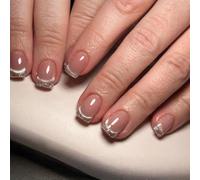 De 24 faux ongles français élégants avec des tons chair et des paillettes argentées pour les fêtes Art Press Ons