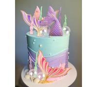 décoration de gâteau en forme de coquillage et de queue de sirène