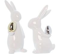 Dekoleidenschaft Lot de 2 lapins de Pâques classiques en porcelaine blanche avec œuf de Pâques doré et argenté - 20 + 23 cm de haut - Figurine décorative