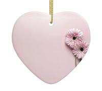 Deux décorations de Noël roses en céramique en forme de cœur imprimées pour accrocher sur les rebords de fenêtre et les cheminées