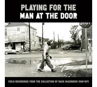 Playing For The Man At The Door