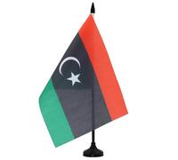 AZ FLAG - Drapeau De Table Libye 21x14 cm - Petit Drapeau Libyen De Bureau 100% Polyester Avec Hampe De 25cm Et Socle En Plastique Noir