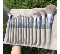Ensemble complet de 14 pinceaux de maquillage gris en poils doux avec sac de rangement portable. Comprend des pinceaux pour ombre à paupières, poudre libre, fond de teint, sourcils, lèvres, correcteur