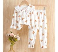 Ensemble confortable et douillet avec motif d'ourson pour jeune fille, fabriqué dans un tissu doux convenant à l'automne/hiver. Le Top présente un grand col et une décoration de volants avec des impri