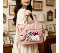 Ensemble de 2 pièces comprenant un grand sac fourre-tout multifonctionnel rose avec imprimé graffiti Hello chat de Sanrio et un porte-monnaie amovible. Peut être porté de plusieurs façons, idéal pour 