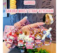 Ensemble de porte-clés bracelet Sanrio Sakura - Porte-clés 3D sous licence officielle représentant My Melody, Hello Kitty, Kuromi, Cinnamoroll et Pochacco. Anneaux porte-clés roses à perles sur le thè