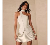 Ensemble élégant pour dame de bureau composé d'un Top sans dos avec décorations de boutons à l'avant et d'une jupe plissée à taille basse. Convient pour le bureau, le thé de l'après-midi, le port quot