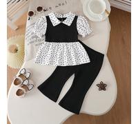 Ensemble printanier et estival de 2 pièces pour bébé fille, confectionné avec des tissus de qualité et présentant un motif à pois ludique pour un style minimaliste à la mode. Le Top à manches bouffant
