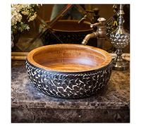 Évier vintage en porcelaine ronde au-dessus du comptoir avec robinet et bonde pop-up pour salle de bain