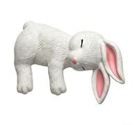 Figurine de lapin blanc endormi