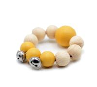 Hochet bracelet de perles de bois jaune curry avec grelots aPunt