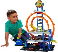 Hot Wheels Garage Méga Loop avec voiture et hélicoptère | Coffret avec véhicule métallique, hélicoptère, 2 boucles et rangement pour 36 véhicules 1:64, JLC05