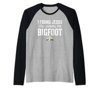 I Found Jesus Still Looking for Bigfoot Funny Christian Manche Raglan
