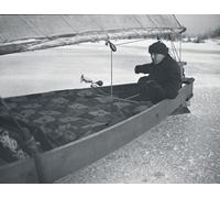 Iceboating in Canada circa 1900. A boat on the ice with a man steering; Canada Poster Print by John Short (17 x 13)