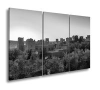 Impression sur toile Kasbah rouge argile dans la lumière dorée du soleil couchant Format : 120 x 80 cm (3 pièces) Effet : noir et blanc XXL Impression d'art sur châssis Décoration de salon