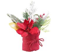 Composition florale de Noël avec fleurs, branches, baies et neige artificielle