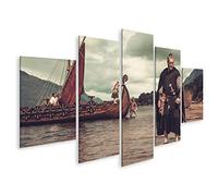 islandburner Impression sur toile - Guerrier viking avec épée debout près de Drakkar sur la côte
