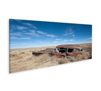 islandburner Impression sur toile Motif voiture rouillée dans le désert solitaire sous un ciel bleu - Toile 120 x 40 cm - Panorama