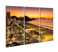 islandburner Prime Image sur toile Coucher de soleil sur la plage avec lumières dans la ville Images murales Poster