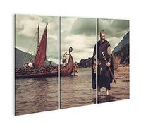 islandburner Prime - Tableau sur toile - Guerrier viking avec épée debout près de Drakkar au bord de la mer