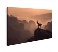islandburner Tableau sur toile Chèvre majestueuse sur rochers dans un paysage de montagne brumeux - Edition O1