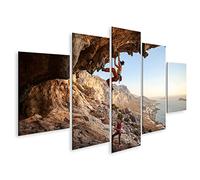 islandburner Tableau sur Toile Une Jeune Femme Grimpe sur Le Mur De La Grotte Au Bord De La Mer Cadre Affiche Poster Murale Tableaux